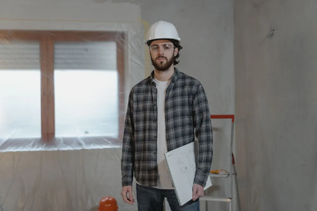Contractor holding plans during a home renovation