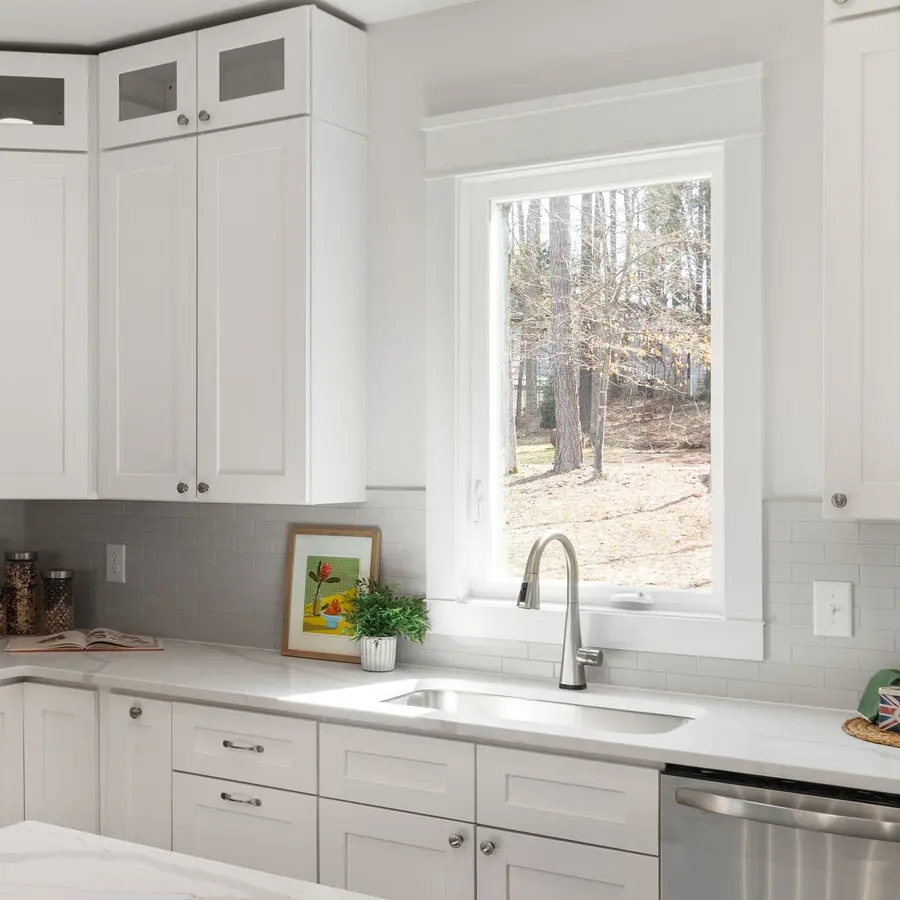 Newly installed white kitchen cabinets with stainless steel appliances